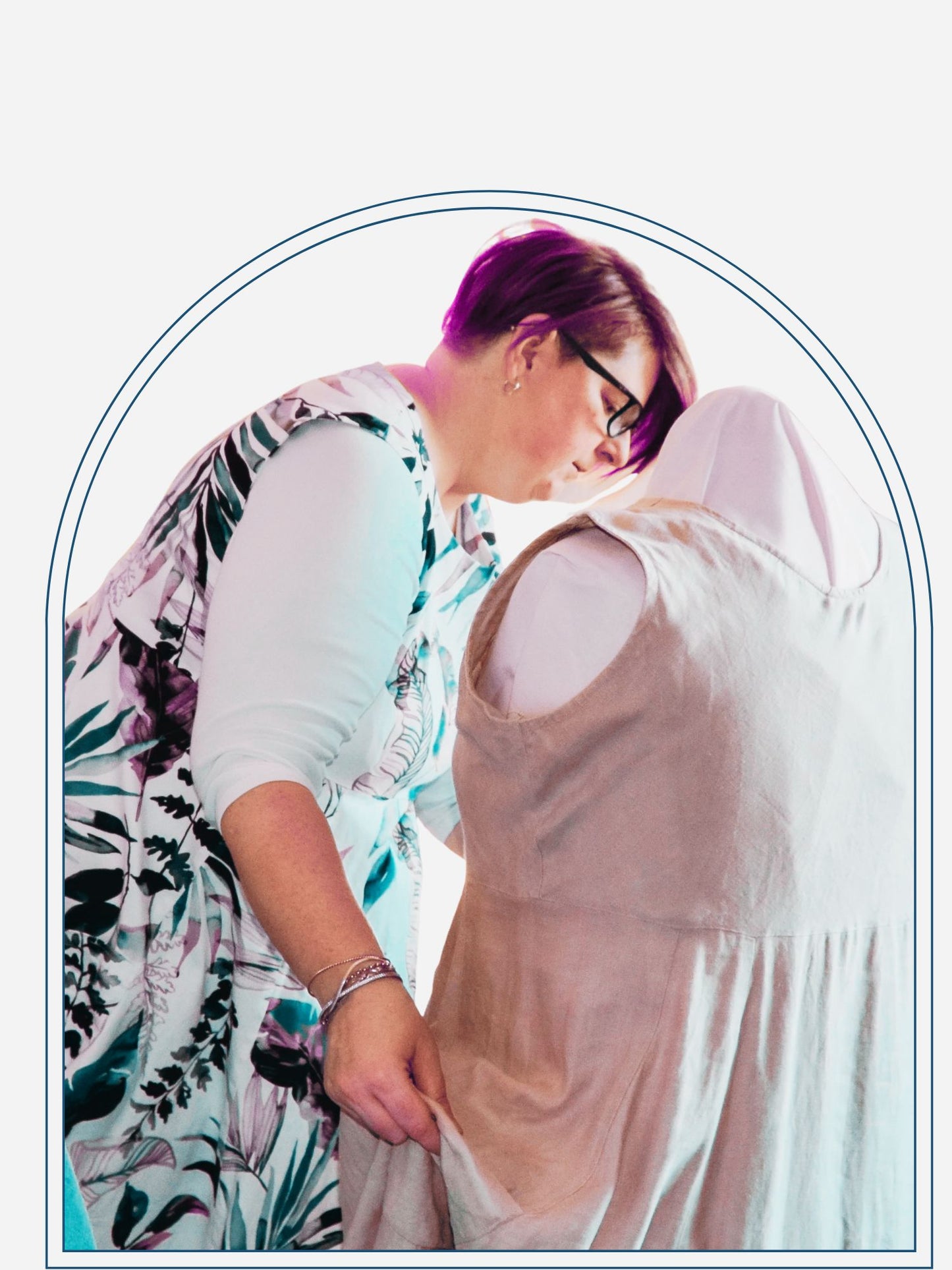 A person examining a dress on a mannequin, likely a consultation for custom pattern services.